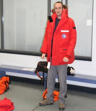 Alex Brisbane trying on his NSF-issued Antarctic Parka.